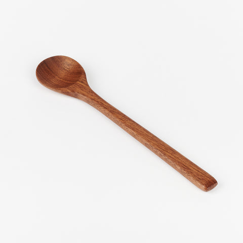 A small walnut wooden stirring spoon made by JBrody & Co