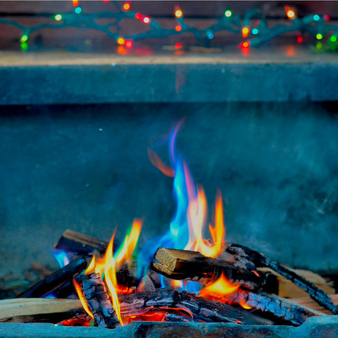 a picture of a fire with blue and green flames showing the magic fire sticks at work giving the fire a unique color spectrum