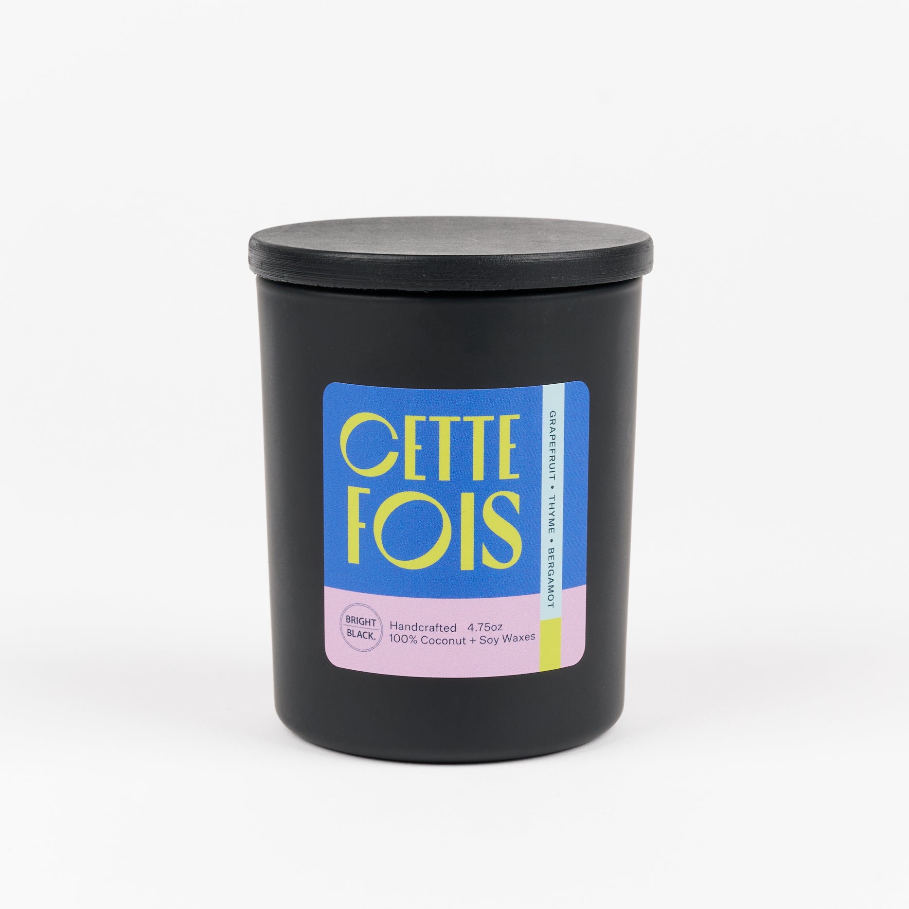 CETTE FOIS - a collaboration with Bright Black Candles is a scented candle in a black jar with scent notes of Grapefruit, Thyme, and Bergamot