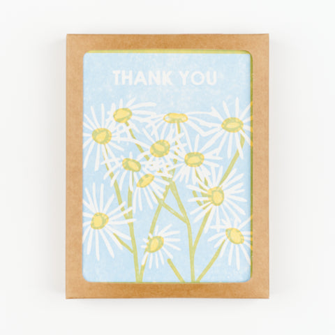 Box set of 6 thank you cards with blue background and daisy floral design and the words Thank You on the front of each card
