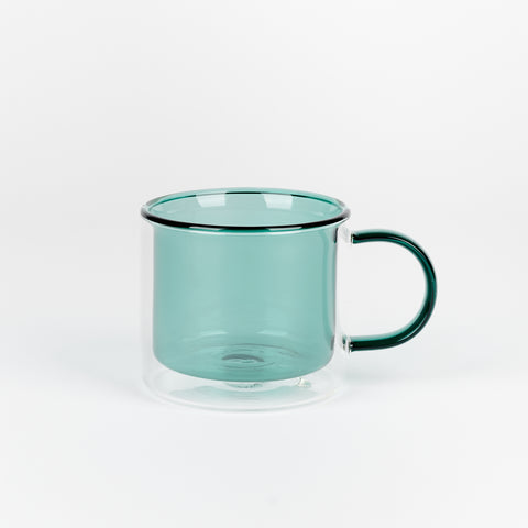 A Poketo Double Wall Mug made of borosillicate glass in Teal