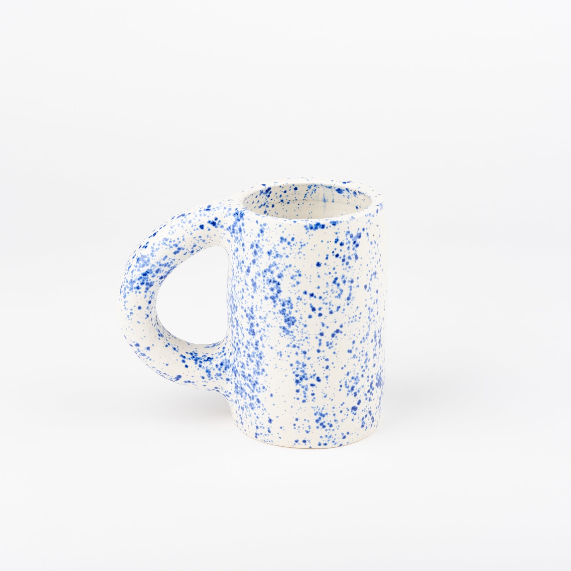 a blue speckled ceramic mug 