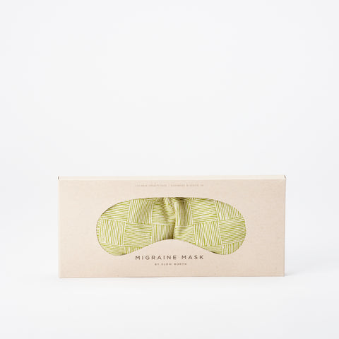 Migraine eye mask with a green checked pattern by Slow North