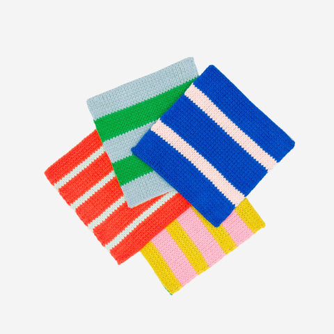 Set of four Verloop colorful striped knitted coasters on a white background, part of the Pop of Color gift set.