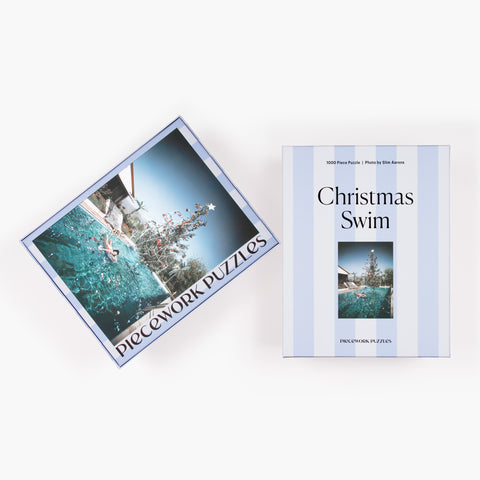Christmas Swim 1000-piece puzzle for the holidays, showing front and back of the puzzle box.