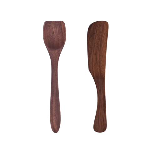 Two piece walnut spreader set on a white background