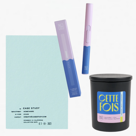 Product set with a notebook, pen, and candle on a white background