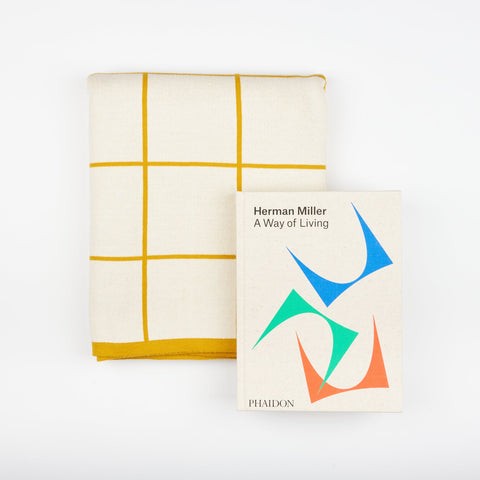 Phaidon design book Herman Miller - A Way of Living and a Sophie Home Citrus Grid Cotton Throw blanket