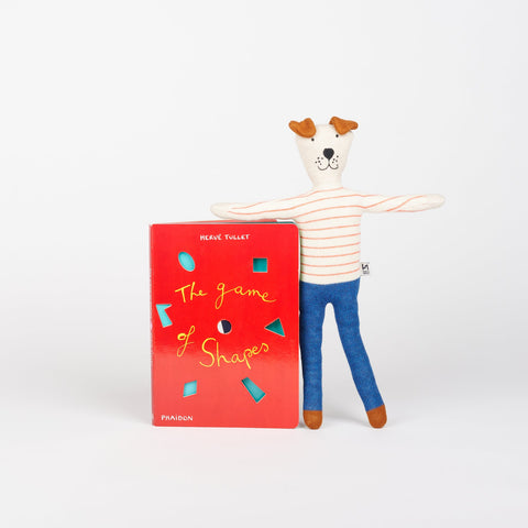 Sophie Home Stuffed animal dog in red stripes standing next to Phaidon Kids book The Game of Shapes by Herve Tullet