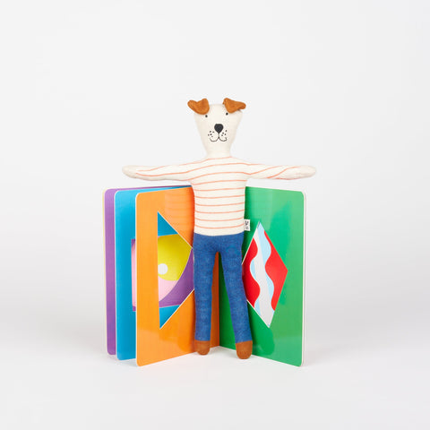 Sophie Home Kids Dog in red stripes stuffed animal toy standing in open Phaidon Kids book The Game of Shapes