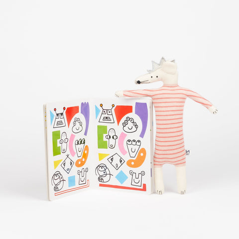 Phaidon Book the Game of Patterns open to show inside colorful illustrations and a Sophie Home Kids party mouse stuffed animal toy